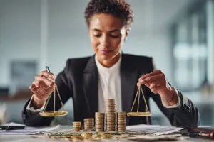 Scales balancing assets and debts, representing equitable distribution of marital debt in divorce.